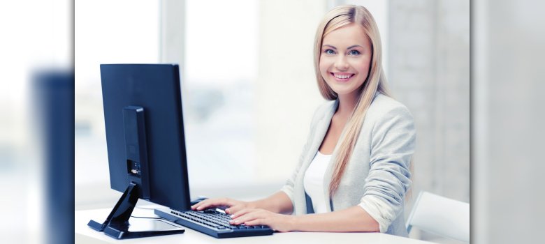Woman sitting in front of screen and keyboard at office work.
